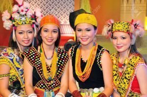 dayak girl in Borneo beauty pageant with traditional costume
